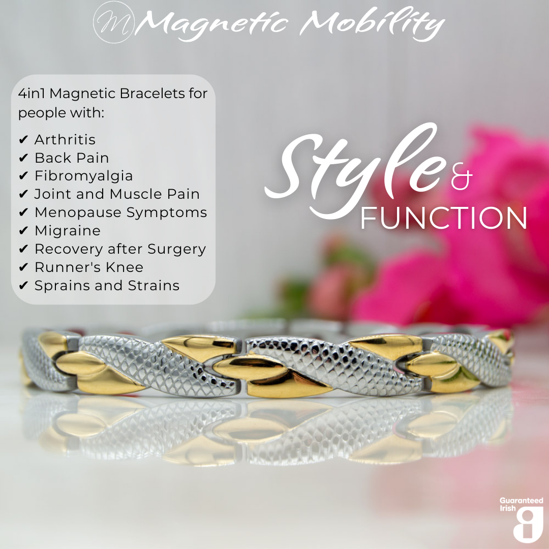 Front view of the Snapdragon Moon 4in1 Magnetic Bracelet, silver and gold coloured bracelet with snakeskin type designs, designed for pain relief, featuring various therapeutic elements. The bracelet is shown on a reflective surface with a pink flower behind it.