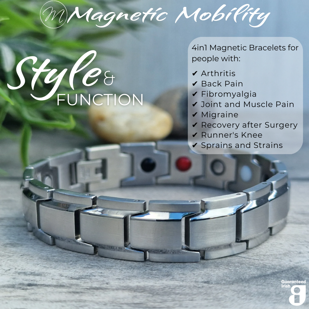 45 degree view of 4in1 magnetic bracelet Alexanders Star by Magnetic Mobility, featuring a sleek sliver design. The bracelet is designed for people with arthritis, back pain, fibromyalgia, joint and muscle pain, menopause symptoms, migraine and more. The bracelet is shown on a wooden surface