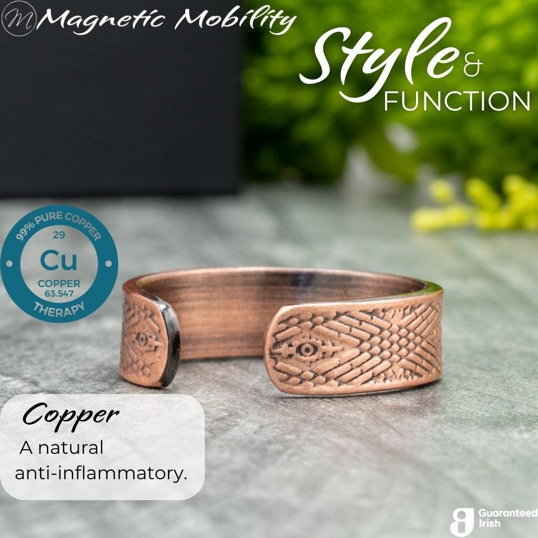 Back view of the Hawthorn copper ring from Magnetic Mobility. Shown on a white gift box with green plants in the background. The writing says "Style and Function" and shows a Guaranteed irish logo.