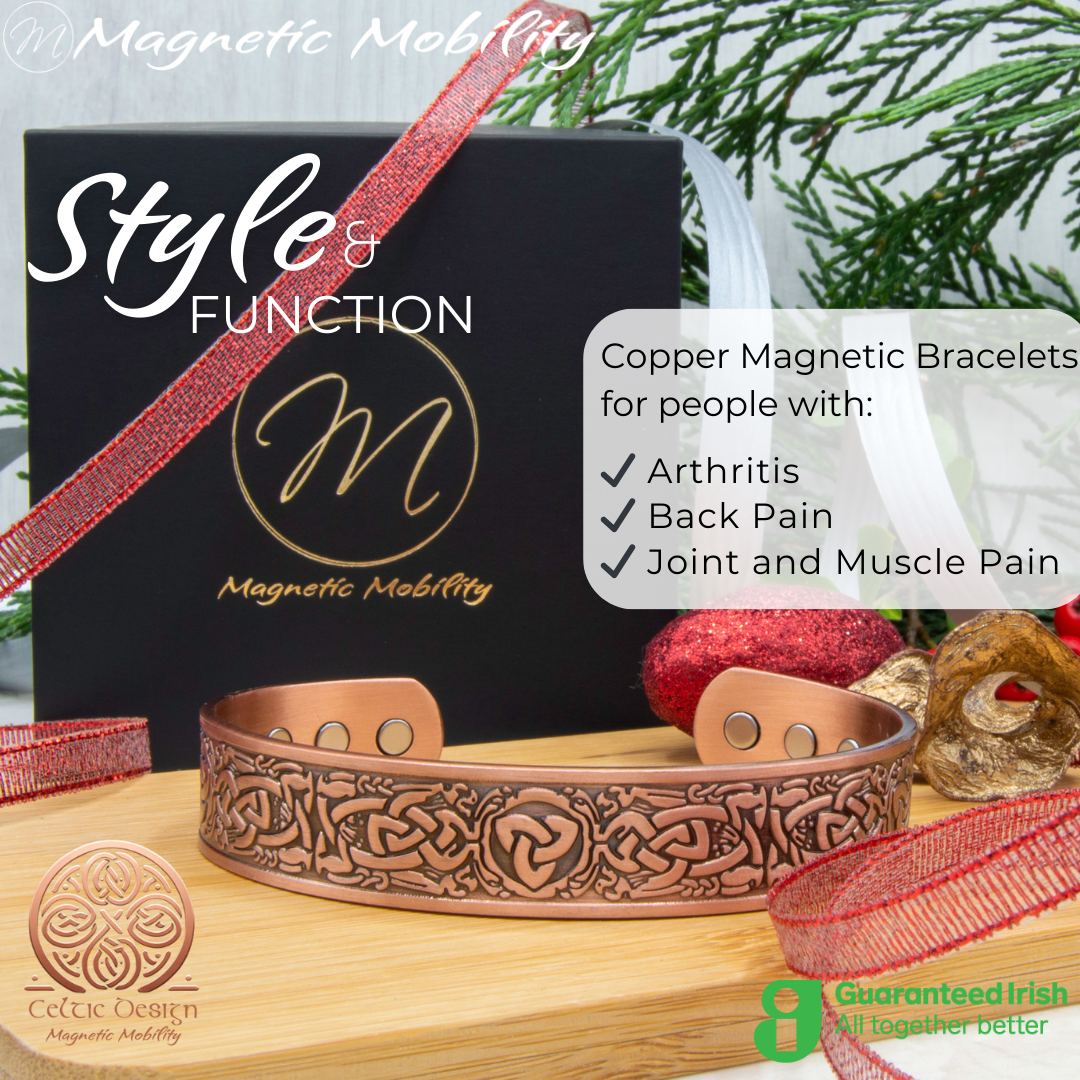 Front view of the Trinity copper bracelet by Magnetic Mobility. Shown on a wooden surface with a black gift box and Christmas decorations. The words "Style and Function" are written on the image along with "Copper Magnetic Bracelets for people with arthritis, back pain and more". Part of the Celtic Collection. Features a guaranteed Irish logo.