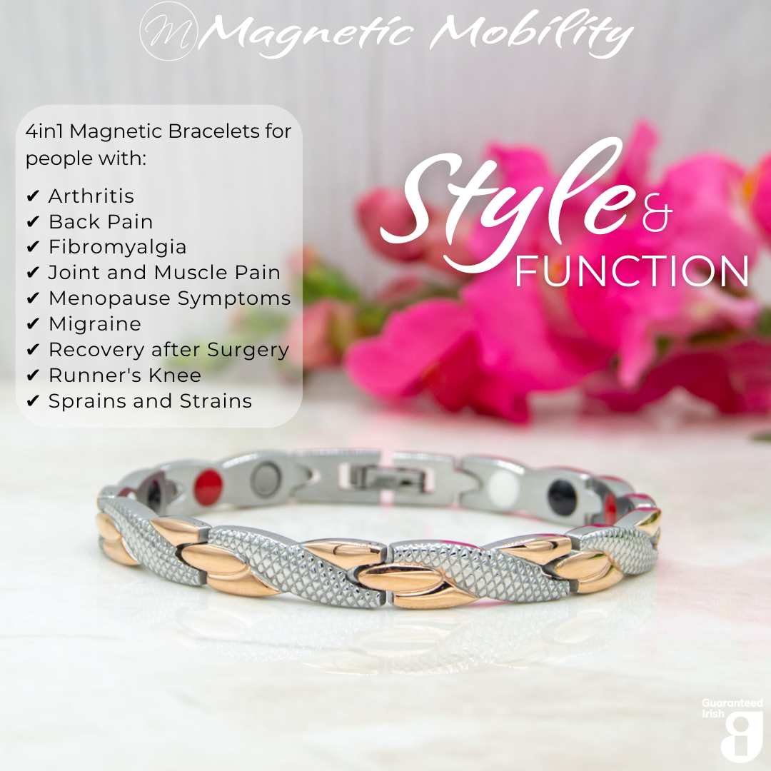 45 degree view of the Snapdragon Dusk 4in1 Magnetic Bracelet from Magnetic Mobility showing the 4in1 elements in the back of the bracelet. The bracelet is on a reflective surface with pink flowers. 