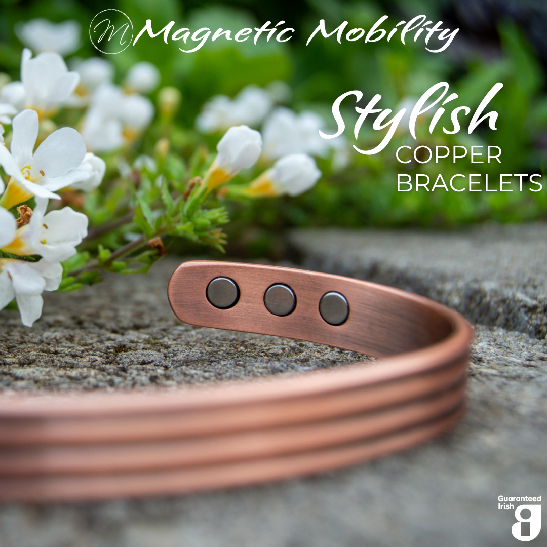 Front view of the heath copper bracelet from Magnetic Mobility. The copper bracelet is featured on a stone surface in a garden signifying its popularity among gardeners for helping combat aches and pains. Text states " Stylish Copper Bracelets" and the image features the Guaranteed Irish Logo. 