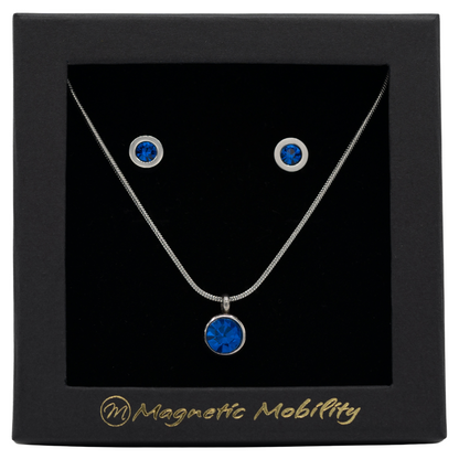 December Magnetic Mobility Birthstone Gift Set featuring a Magnetic Necklace and Stud Earrings featuring Blue Swarovski crystals, elegantly presented in a black box with Magnetic Mobility branding. These magnetic back earrings offer stylish pain relief.