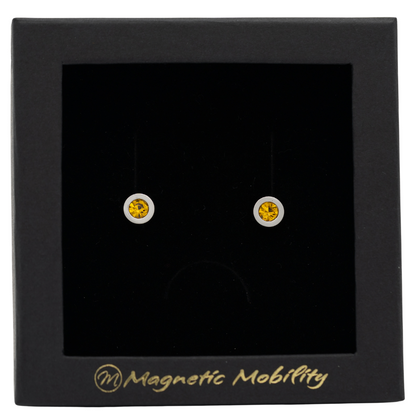 Magnetic Mobility November Birthstone Stud Earrings featuring citrine Swarovski crystals, elegantly presented in a black box with Magnetic Mobility branding. These magnetic back earrings offer stylish pain relief.