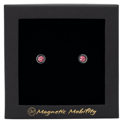 Magnetic Mobility October Birthstone Stud Earrings featuring pink tourmailne Swarovski crystals, elegantly presented in a black box with Magnetic Mobility branding. These magnetic back earrings offer stylish pain relief.